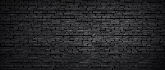 Foto op Plexiglas Bakstenen muur Textuur van een zwart geschilderde bakstenen muur als achtergrond of behang