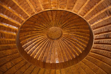 Beautiful ancient pattern wooden dome. Look up inside a wooden roof
