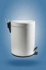 The white trash bin that looks clean is suitable for use in the home or office.