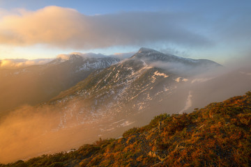 Beautiful Morning Light In Mountains Jagged in Fog