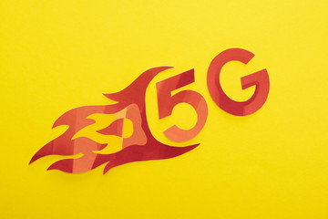 top view of red 5g with flame lettering on yellow background