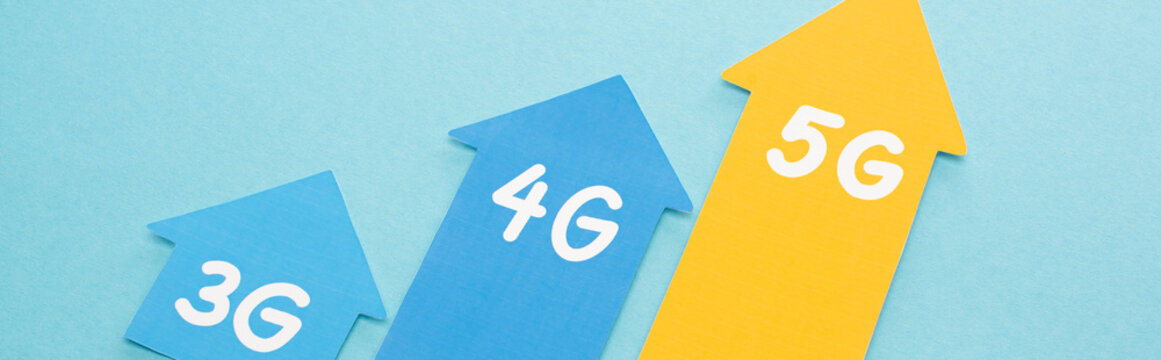 3g, 4g and 5g arrows on blue background, panoramic shot
