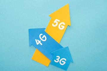 top view of 3g, 4g and 5g arrows on blue background