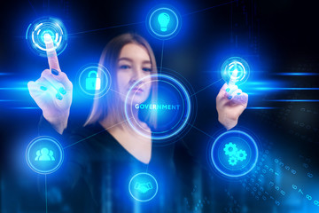 Business, Technology, Internet and network concept. Young businessman working on a virtual screen of the future and sees the inscription: Government