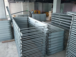 Mild Steel Door Frame stacked horizontally at the construction site. Workers will transport the frame to the designated installation location. 