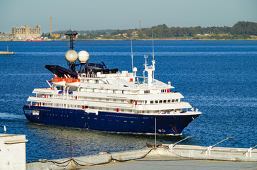Small expedition cruiseship or cruise ship liner vessel MV Corinthian arrival into port of...