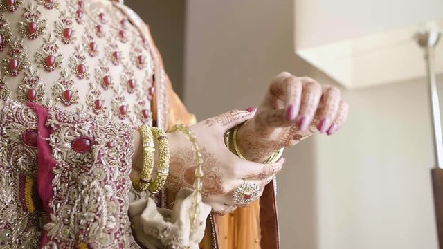 Asian wedding | bride placing bangles on her wrist (SLOW MOTION)