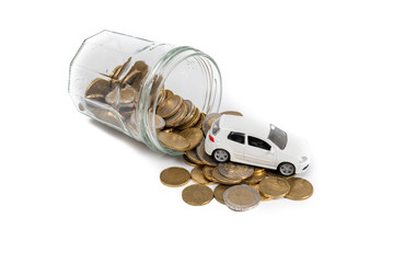 Miniature car model and Financial statement with coins. Finance and car loan, saving money for a car or material design concepts.