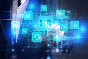 Business, Technology, Internet and network concept. Young businessman working on a virtual screen of the future and sees the inscription: HR