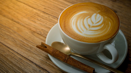 close-up coffee cup on wooden table top view.
