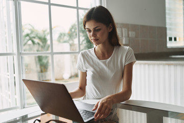 young woman working on laptop