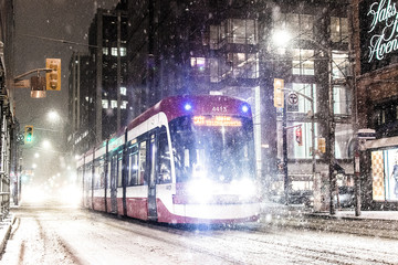 tram in the city during a snowstorm