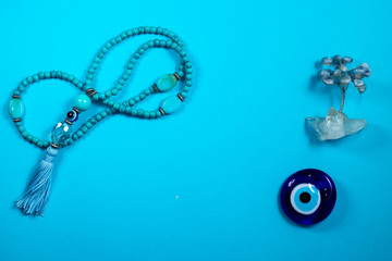 Blue oriental Japa Mala (mala Sanskrit), Tree of stones  and  Greek Eye - Blue background 