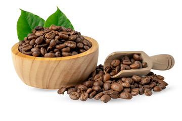 Coffee bean medium roasted in wooden bowl with leaf in fresh morning.