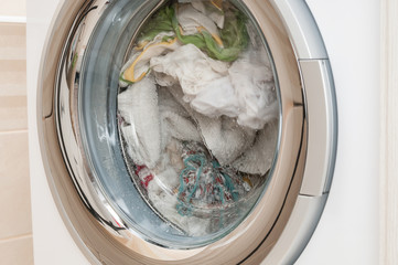 Wash clothes in washing machine close up