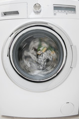 Wash clothes in a washing machine close up