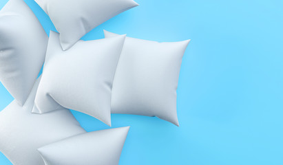 White pillows on a blue background. The concept of rest, sleep, laziness. Several pillows are lying randomly, top view. 3D rendering.