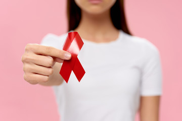 young woman holding a red heart