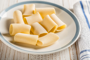 paccheri on plate with rolling pin