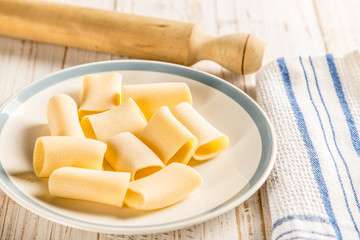 paccheri on plate with rolling pin