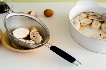 Cooking torrijas, a typical Spanish sweet fried toasts of sliced bread soaked in eggs and milk.