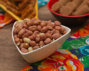 several bowls full of peanuts on the table