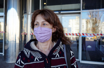 Woman wearing hygienic mask to prevent the Coronavirus. People in masks The outbreak of Novel...