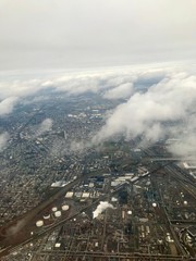 Aerial birds eye view of Elizabeth & Newark, New Jersey (United States of America) close to EWR airport: Urban downtown, highway & turnpike transportation, busy industrial cityscape around the port