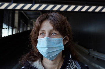 Woman wearing hygienic mask to prevent the Coronavirus. People in masks The outbreak of Novel...
