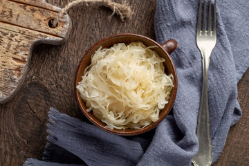 Fermented cabbage in a jar on a table