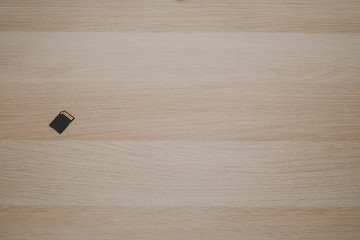 SD memory card on wooden table