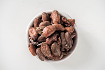 Cocoa beans on white background