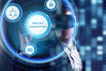 Obraz premium Business, Technology, Internet and network concept. Young businessman working on a virtual screen of the future and sees the inscription: Online marketing