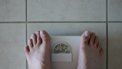 Overweight Person Standing On Digital Scale With Blank White Label