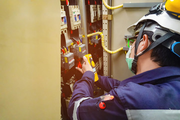 Electrician inspects the power control to find the abnormal condition of transformer by using...