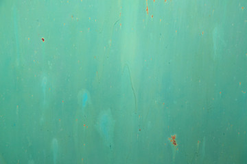 green rusty sheet of metal with smudges of paint for your design or background