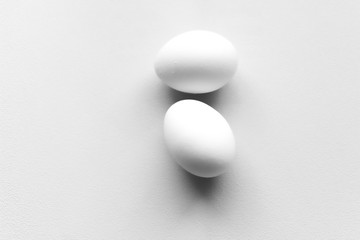 Two eggs monochrome white isolated background