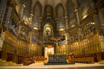 Naklejka premium Cathedral with view in background of Black Madonna at the Benedictine Abbey at Montserrat, Santa Maria de Montserrat, near Barcelona, Catalonia, Spain where some feel the Holy Grail had been