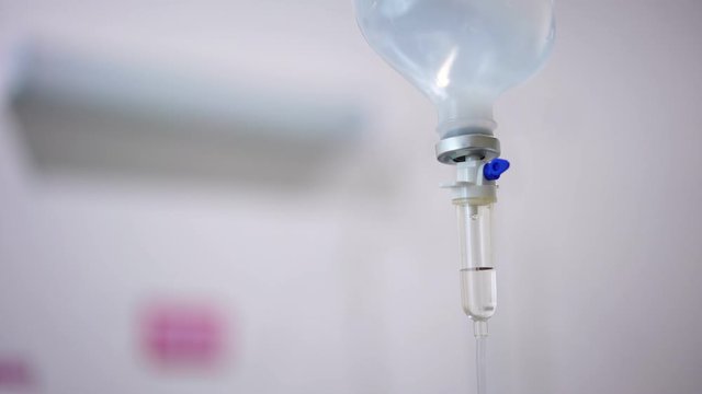 Normal saline solution or sodium chloride with infusion bottle drip for patient in hospital