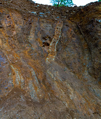 Geological formation with lava colums after magma eruption from stratovolcano