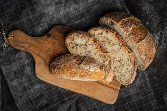 gluten free bread on a wood on a dark background