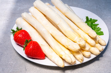 Dutch farmers products, fresh white asparagus and red ripe strawberry in spring season