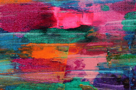 Colorful grunge background in muted colors from a section of an abstract acrylic painting with visible canvas texture.