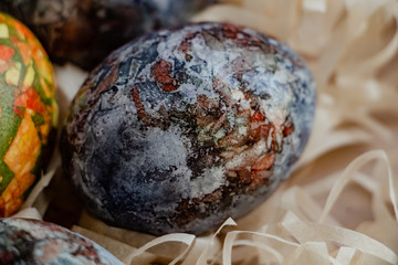 marble blue easter eggs, ears of corn, close up