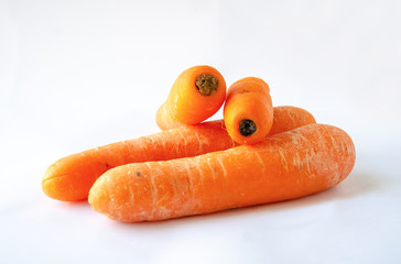 Raw carrots shot against a white background.