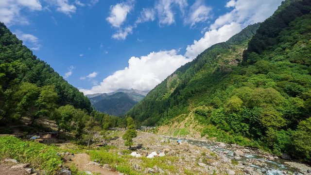 4K time lapse of moving clouds over mountain 