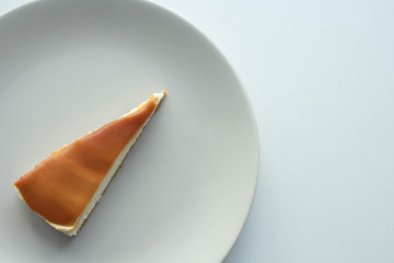 Cheesecake with salted caramel sauce on plate