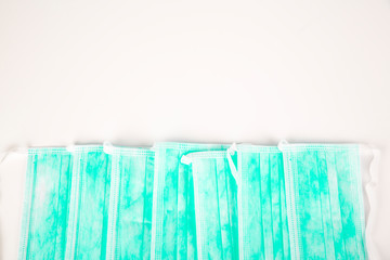 Pile of green surgeon masks, used for covid 19