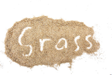 Pile of grass seeds on a white background with 