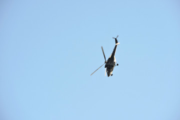 A multipurpose military helicopter PZL W-3 Sokół performing stunts in the blue sky during Nato...